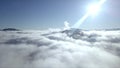 Beautiful landscape with mountain peaks covered with snow and clouds