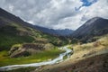 Beautiful landscape of mountain peaks, rivers and lakes. Wild nature of Altai Mountains. Clouds over mountain ranges. Russia,