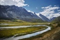 Beautiful landscape of mountain peaks, rivers and lakes. Wild nature of Altai Mountains. Clouds over mountain ranges. Russia,