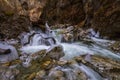 Landscape with a mountain river with small waterfalls in winter day in the canyon Royalty Free Stock Photo