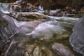 Landscape with a mountain river with small waterfalls in winter day in the canyon Royalty Free Stock Photo