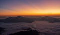 Beautiful landscape on the mountains against sky during sunrise. Spectacular view in foggy valley covered forest under morning sky Royalty Free Stock Photo