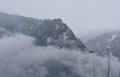 Beautiful Landscape, Mountains covered with snow and surrounded by Morning heavy Fogg in Manali India in the Jan