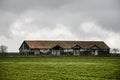 Beautiful landscape of mountains and forest with village building or old abandoned ruined brick house. Foggy forest and old buildi