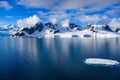 Antarctic landscape with mountains, glacier and ice floe oin dark blue water of Lemaire Channel near Paradise Bay, Antarctica Royalty Free Stock Photo