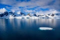 Antarctic landscape with mountains, glacier and ice floe oin dark blue water of Lemaire Channel near Paradise Bay, Antarctica Royalty Free Stock Photo