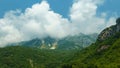 beautiful landscape in the mountains of Montenegro, the movement of clouds, a bright sunny day, a forest on the hillsides