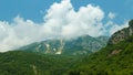 beautiful landscape in the mountains of Montenegro, the movement of clouds, a bright sunny day, a forest on the hillsides