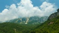 beautiful landscape in the mountains of Montenegro, the movement of clouds, a bright sunny day, a forest on the hillsides