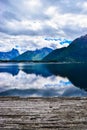 Beautiful landscape of mountains reflected in Romsdal Fjord or Romsdalsfjord in cloudy weather. Andalsnes. Norway Royalty Free Stock Photo