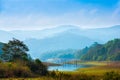Beautiful landscape at mystical day with mountains and lake, t Royalty Free Stock Photo