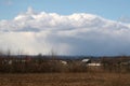 Countryside Landscape Under Stormy Clouds Houses and Mountains With Fields Royalty Free Stock Photo