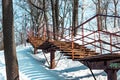 Beautiful landscape with an old rusty stairway in a snow-covered park