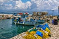 Beautiful landscape with old small fisher boat, colorful fishing nets Royalty Free Stock Photo