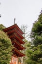 A beautiful landscape with an orange pergola and lush green trees, grass and plants in the Japanese Tea Garden at Golden Gate Park Royalty Free Stock Photo