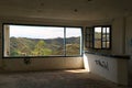 Beautiful landscape out of wide window of an abandoned hotel Royalty Free Stock Photo