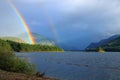 Double Rainbow and Storm Clouds in Evening Light, Upper Campbell Lake, Vancouver Island, British Columbia Royalty Free Stock Photo