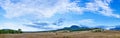 Beautiful landscape panorama with fleecy clouds Royalty Free Stock Photo