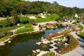 A beautiful landscape park, a lake, wooden pavilions, a red bridge in the Japanese style from Uman, Ukraine, New Sofiyivka. Aerial Royalty Free Stock Photo