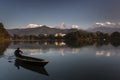 Beautiful landscape with Phewa Lake and boat on lake, mountains in background also as reflectaion on lake.  Machapuchare-FIshtail Royalty Free Stock Photo