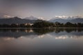 Beautiful landscape with Phewa Lake and mountains in background also as reflectaion on lake.  Machapuchare-FIshtail, Annapurna and Royalty Free Stock Photo