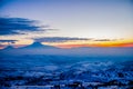 Mountains and fields are covered with snow. Beautiful sunrise Royalty Free Stock Photo