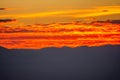 Red clouds like a lava. Beautiful fiery sunset with red clouds Royalty Free Stock Photo