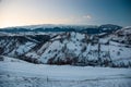 Beautiful landscape of Piatra Craiului Mountains at sunset in a cold and sunny day during winter season Royalty Free Stock Photo