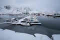 Beautiful landscape pier with fishing boats with snow in winter season, Lofoten islands, Norway Royalty Free Stock Photo