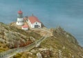 Beautiful landscape, Point Reyes lighthouse on the rocky coast of the Pacific Ocean, a long staircase leads to it Royalty Free Stock Photo
