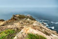 Beautiful landscape, Point Reyes lighthouse on the rocky coast of the Pacific Ocean, a long staircase leads to it Royalty Free Stock Photo