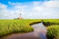 Beautiful landscape with pond and lighthouse at North Sea, Germany Royalty Free Stock Photo