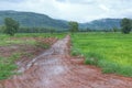 Beautiful landscape, rainy season, dirt road in the countryside overlooking the mountains, Thailand. Royalty Free Stock Photo