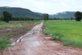 Beautiful landscape, rainy season, dirt road in the countryside overlooking the mountains, Thailand. Royalty Free Stock Photo