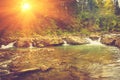 Beautiful landscape of rapids on a mountains river in sunrise. Royalty Free Stock Photo