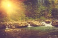 Beautiful landscape of rapids on a mountains river in sunrise. Royalty Free Stock Photo