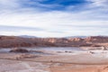 Beautiful landscape with red rocks, clouds and blue sky at Valle de La Luna during sunset Royalty Free Stock Photo