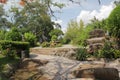 Beautiful landscape with the road, stones and green trees around in the blue sky