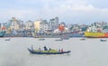 Beautiful landscape of Sadarghat river port on Buriganga river in Dhaka. Ferry boats on the river with a cloudy sky background Royalty Free Stock Photo