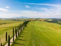 Beautiful landscape scenery of Tuscany in Italy - cypress trees along white road - aerial view -  close to Asciano, Tuscany, Italy Royalty Free Stock Photo