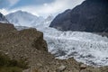 Passu Glacier against snow capped mountains in Karakoram range. Gilgit Baltistan, Pakistan Royalty Free Stock Photo