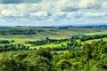 Beautiful landscape in Scotland with hills, fields and white clouds Royalty Free Stock Photo