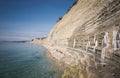 Beautiful landscape sea view. Shore with white pebbles and rocks on a spring day Royalty Free Stock Photo