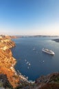 Beautiful landscape with sea view on the Sunset. Cruise liner in the Aegean Sea, Thira, Santorini island, Greece. Summer seascape Royalty Free Stock Photo