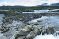 Beautiful landscape seeing from dam of Lake Finsevatnet, snowy mountains and glacier in Finse, Norway Royalty Free Stock Photo