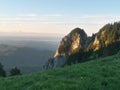 Beautiful landscape seen from top of the green mountain in summer season. horizon line on sunny day with blue sky and fluffy cloud Royalty Free Stock Photo