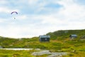 Beautiful landscape with small houses and paraglider seen from way to the Mount Ulriken peak in Bergen, Norway
