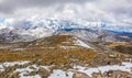 Beautiful landscape of snow-covered mountains and fluffy clouds Royalty Free Stock Photo