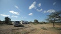 Beautiful landscape of the steppe, house in the field and car in Africa. Royalty Free Stock Photo