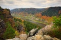 Beautiful landscape, stone above Labe river, forest. Sunset, Czech national park Ceske Svycarsko. Misty evening autumn nature. Lan